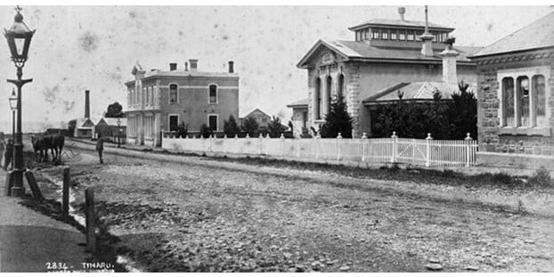 Courthouse, Timaru. Burton Bros. postcard. View of North St. showing from left Mechanics' Institute, Court House and Police Station, taken ca 1880s. Bollinger, Mrs, fl 1958 :Scenic photographs of New Zealand. Ref: PAColl-0808-01. Alexander Turnbull Library, Wellington, New Zealand. /records/23219877 | Alexander Turnbull Library, Wellington